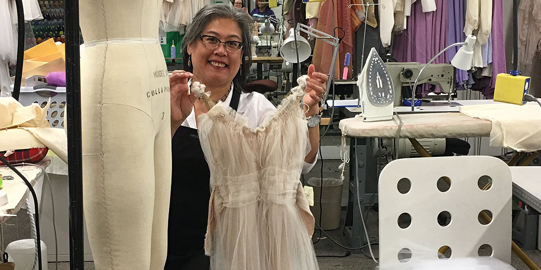 Iris Weng working on a costume for “Topia”