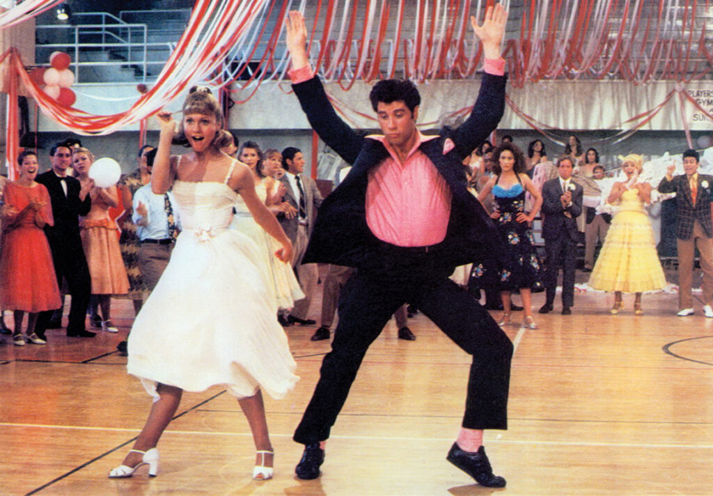 Olivia Newton-John and John Travolta in "Grease" (1978) © Paramount Pictures.