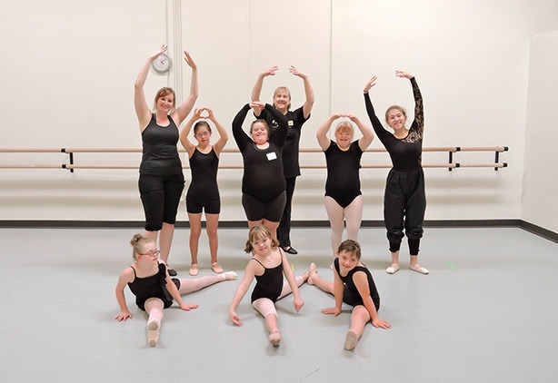 A group of Down syndrome performers posing for a picture