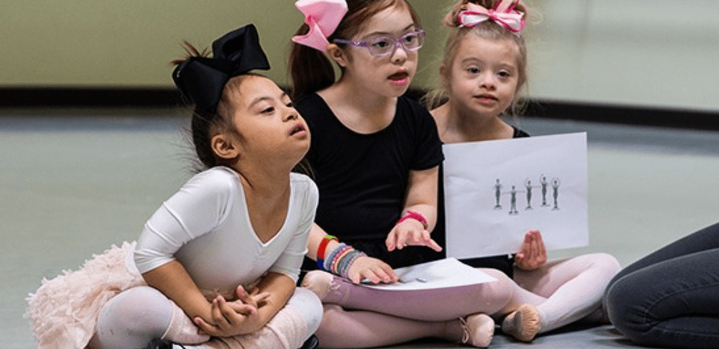 a group of children sitting on the floor